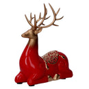 Renna resina seduta oro e rosso cm 17x8xh20