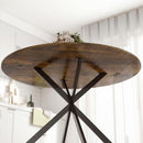 Tavolo da Pranzo Rotondo Stile Industriale Ø100x75 cm con Piano in Truciolato e Gambe a Croce in Acciaio Marrone Rustico      