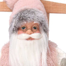 Babbo natale in tessuto su sedia rosa cm xh30