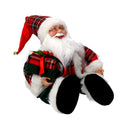 Babbo natale in tessuto rosso seduto con regali, musica e movimento cm xh35,5