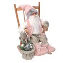Babbo natale in tessuto su sedia rosa cm xh30