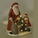 Statua resina babbo natale con bambina rosso con led cm 15x11xh18,5