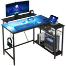 Scrivania Angolare Reversibile LED integrati Prese USB Ripiani e Supporto Monitor Nero 