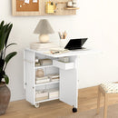 Tavolo a Ribalta Pieghevole con Ripiani a 3 Livelli Box e Rotelle 130x80x76,5 cm in MDF Bianco