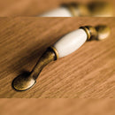 Maniglie per Mobile Interasse 76 mm Zama e Ceramica Bronzo 20 Pezzi Emuca