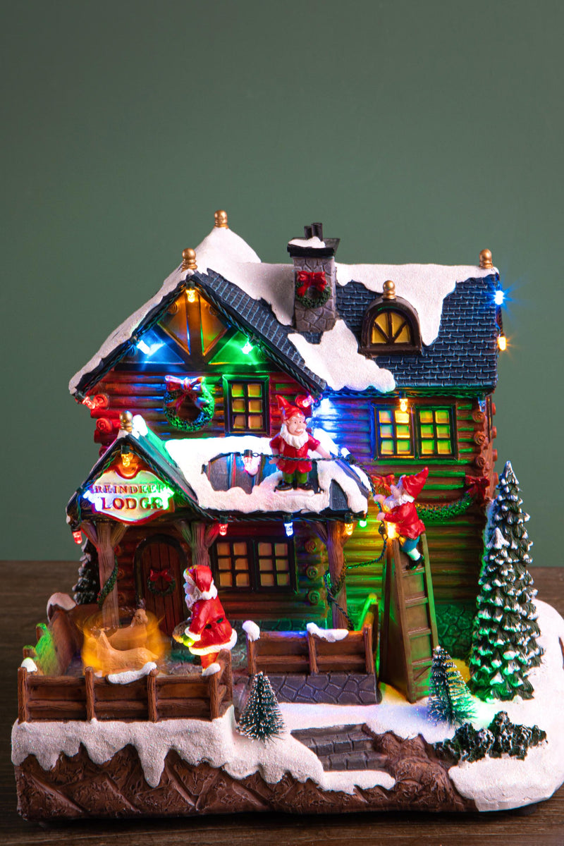 Villaggio Natalizio Casa di Babbo Natale con Luci Musica e Movimento H25,5 cm in Resina-2